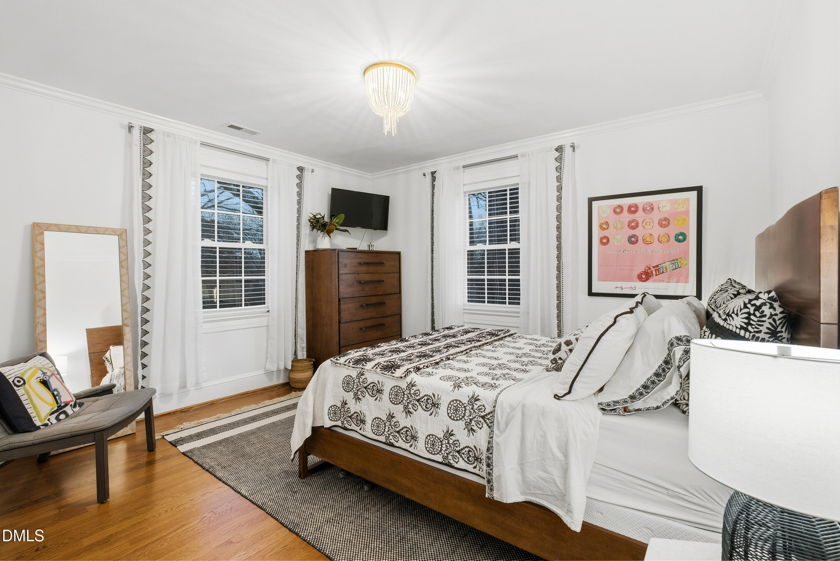 1110 North Gregson Street Durham, NC 27701 - Photo 19 of 38 a bedroom with a bed and wooden floor