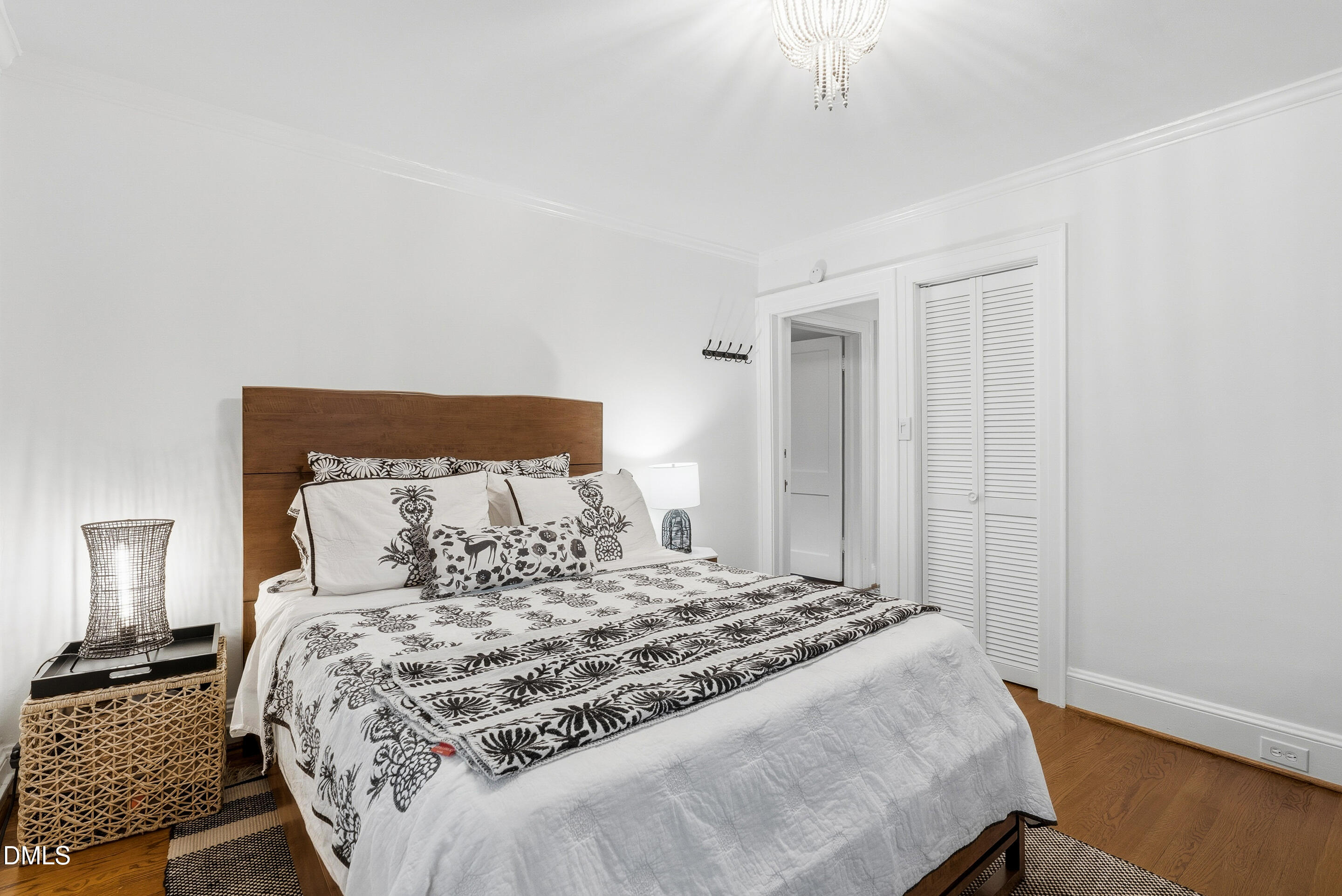 1110 North Gregson Street Durham, NC 27701 - Photo 20 of 38 a bedroom with a large bed and a night stand