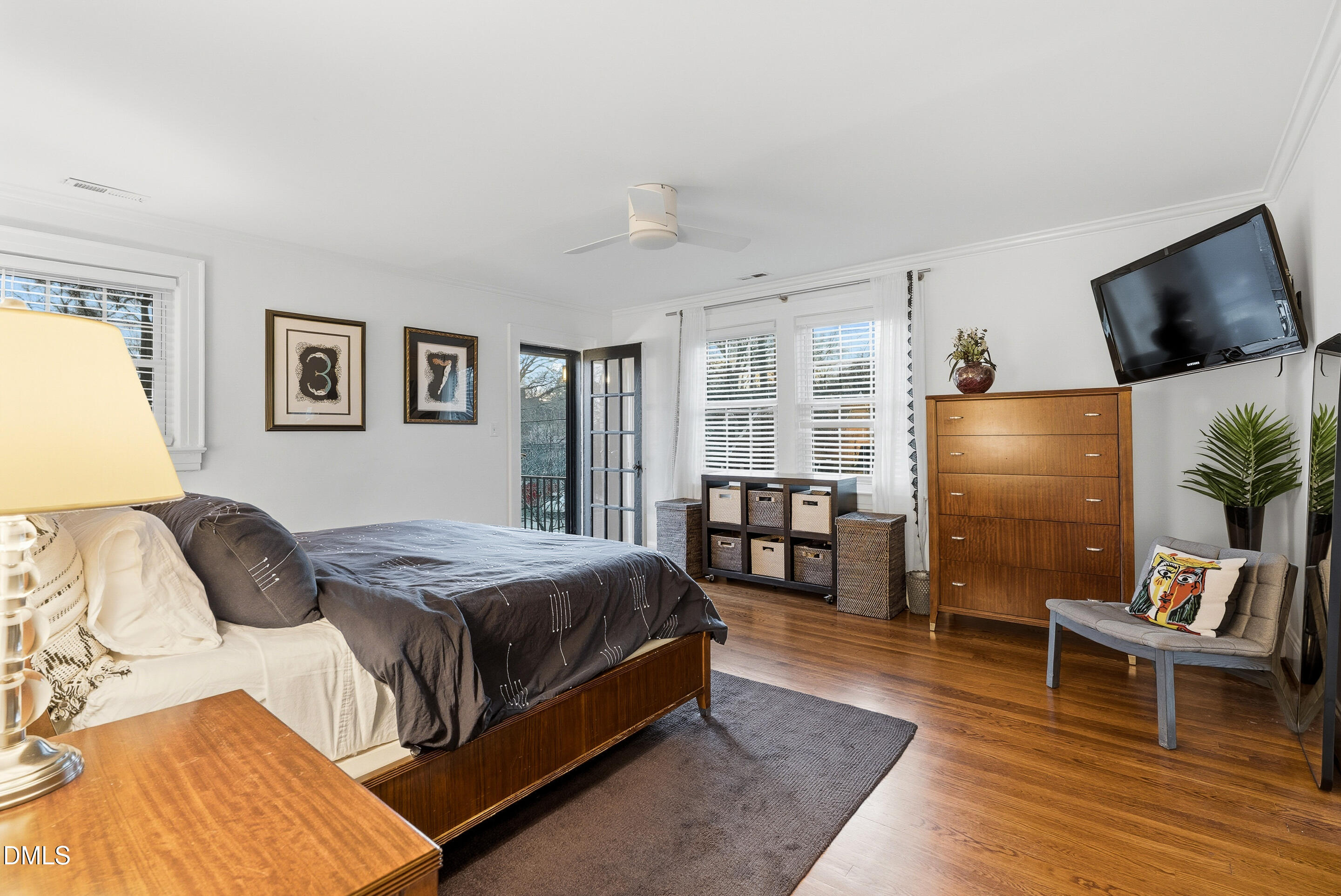 1110 North Gregson Street Durham, NC 27701 - Photo 21 of 38 a bedroom with furniture and a flat screen tv