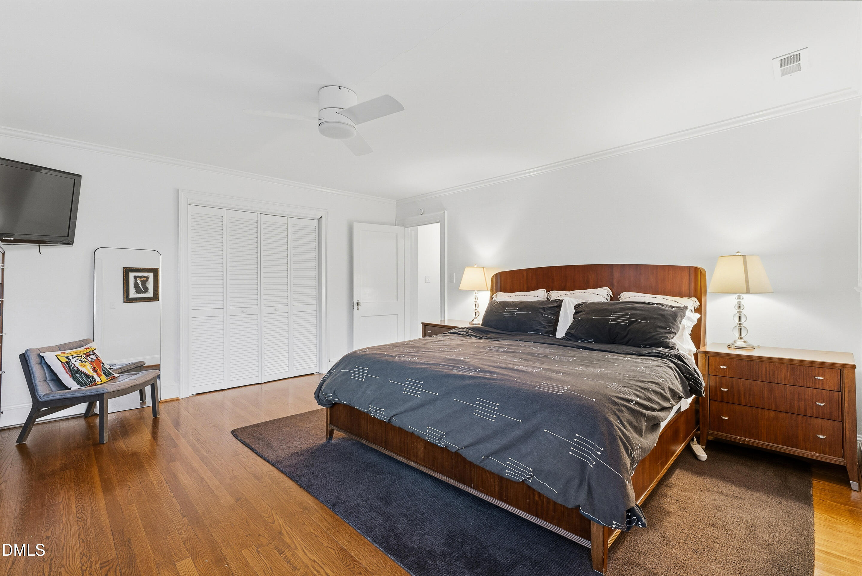 1110 North Gregson Street Durham, NC 27701 - Photo 22 of 38 a spacious bedroom with a bed and a table in it