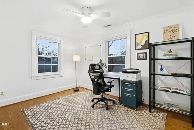 a view of room with furniture and wooden floor