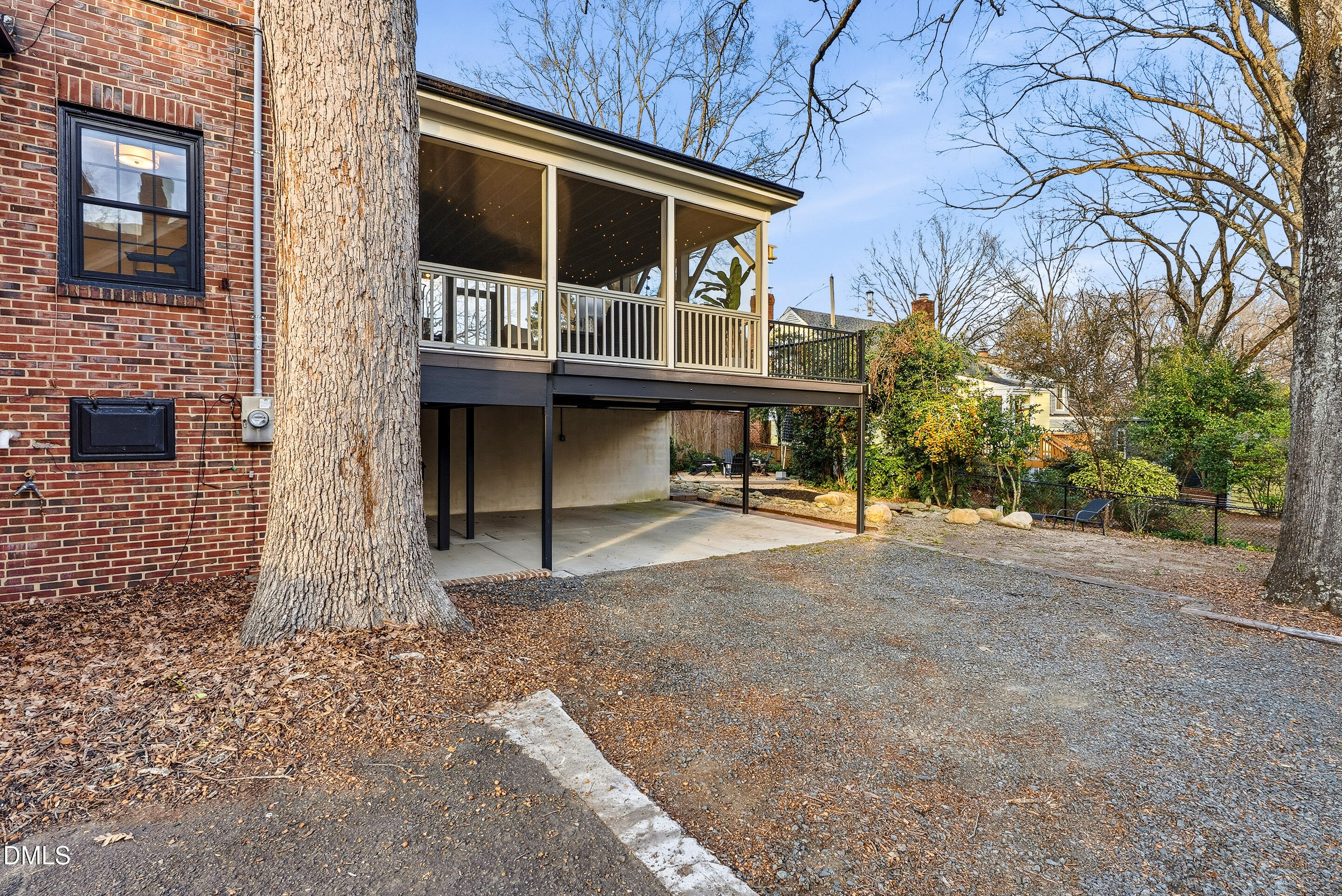 1110 North Gregson Street Durham, NC 27701 - Photo 33 of 38 a view of house with a large window and wooden fence