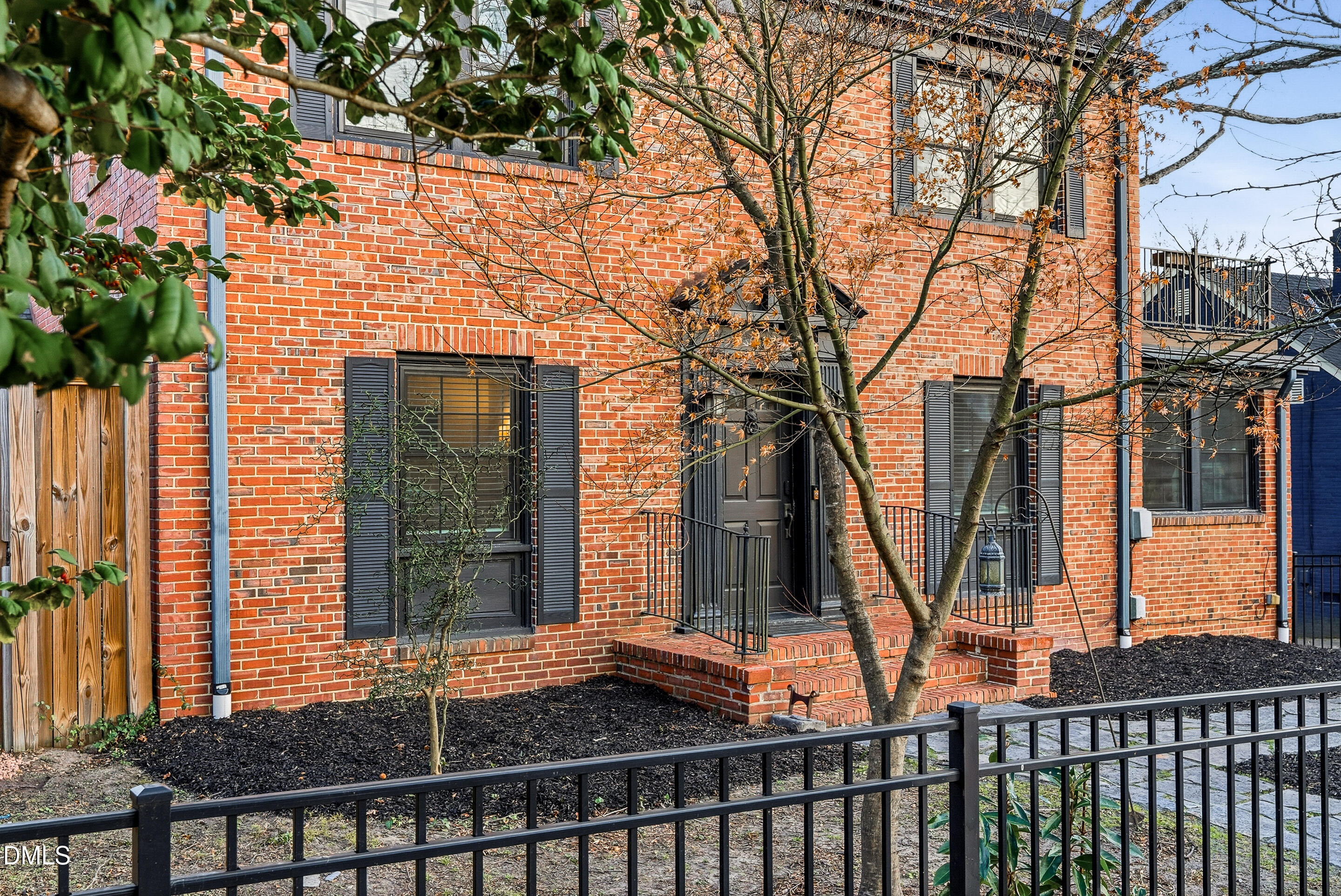 1110 North Gregson Street Durham, NC 27701 - Photo 4 of 38 a front view of a house with a yard