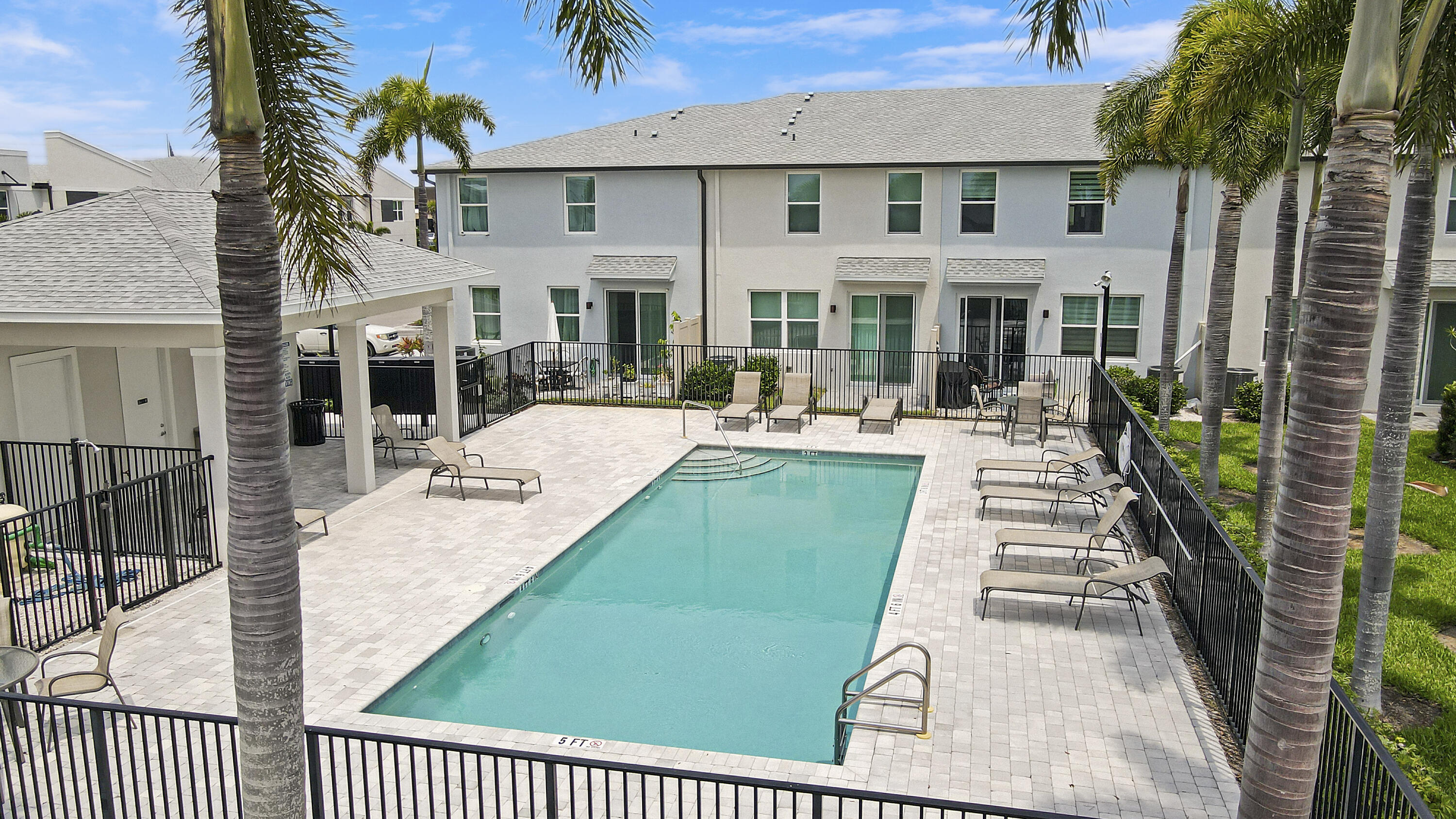 3903 Southeast Mentmore Lane Stuart, FL 34997 - Photo 11 of 35 front view of a house with a patio