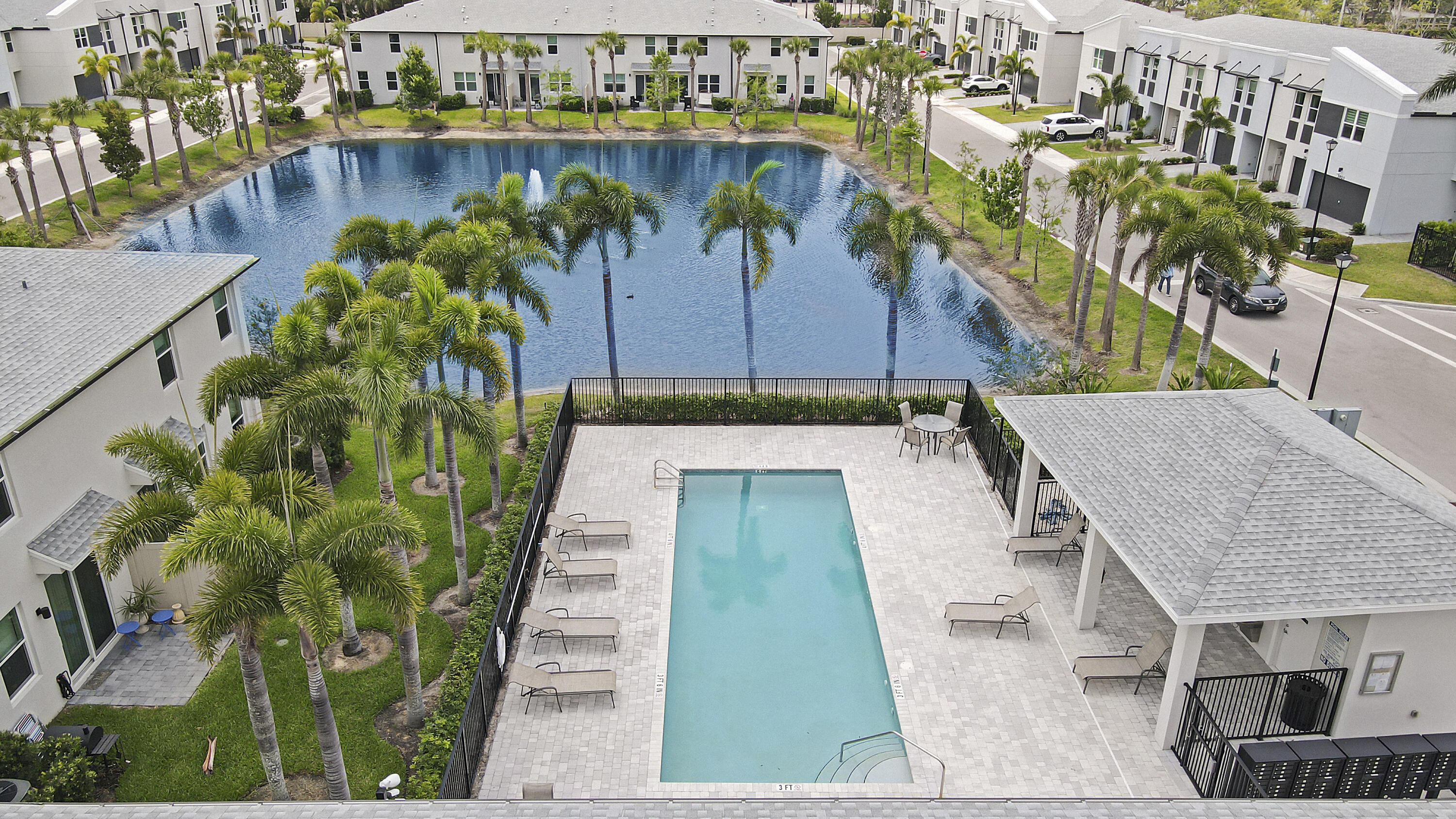 3903 Southeast Mentmore Lane Stuart, FL 34997 - Photo 13 of 35 a view of a swimming pool with a patio