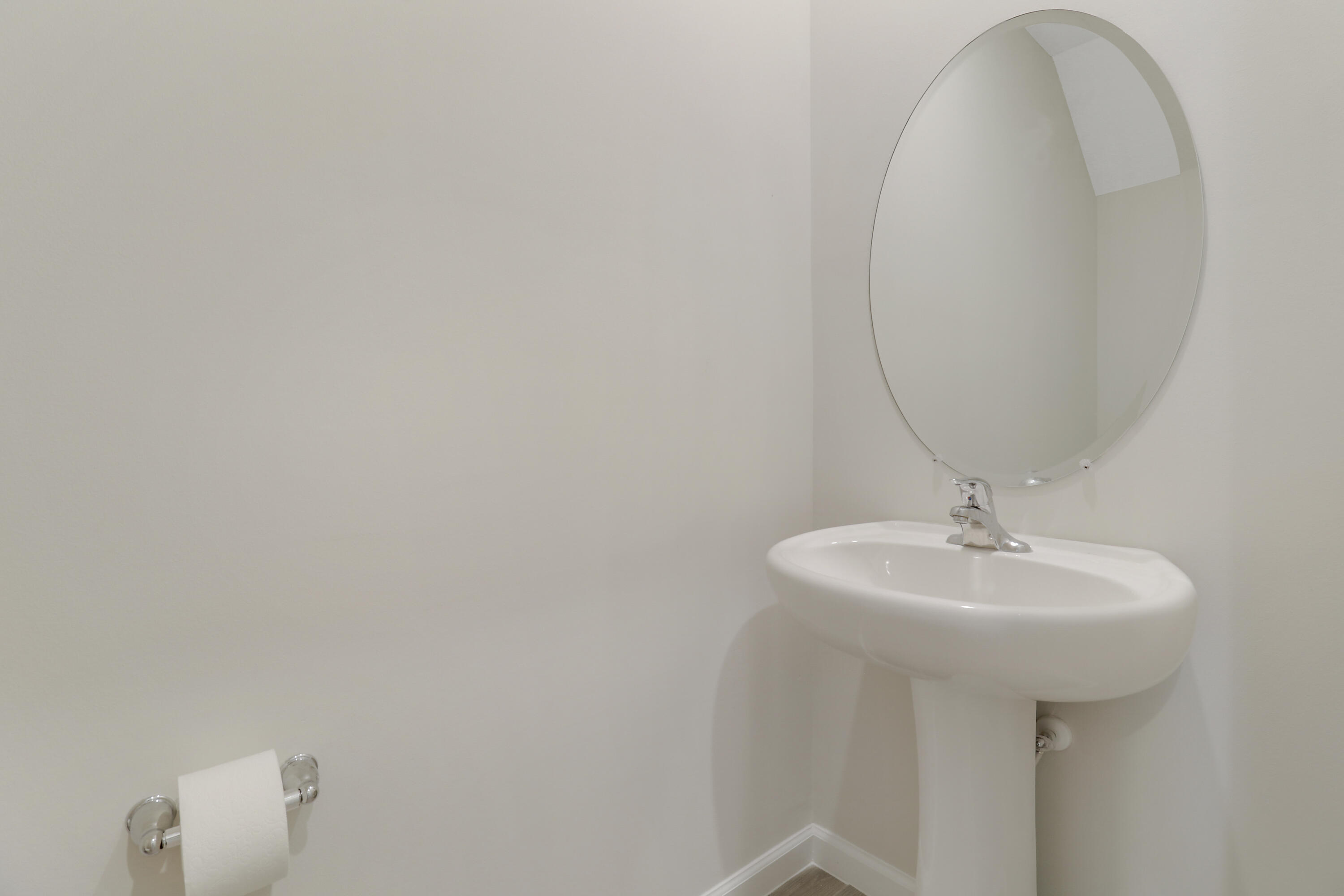 3903 Southeast Mentmore Lane Stuart, FL 34997 - Photo 14 of 35 a bathroom with a sink a mirror and a toilet