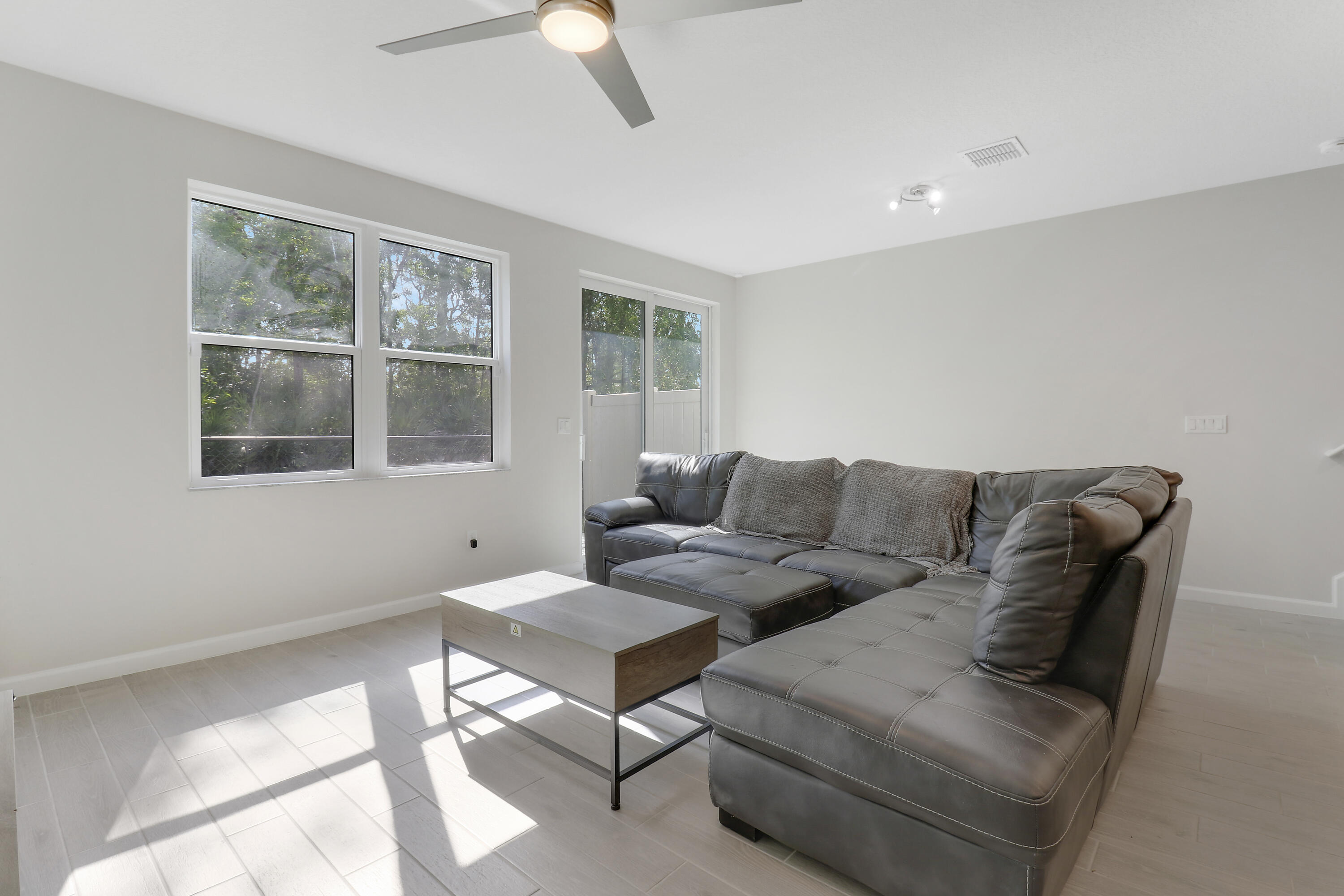 3903 Southeast Mentmore Lane Stuart, FL 34997 - Photo 19 of 35 a living room with furniture and a window