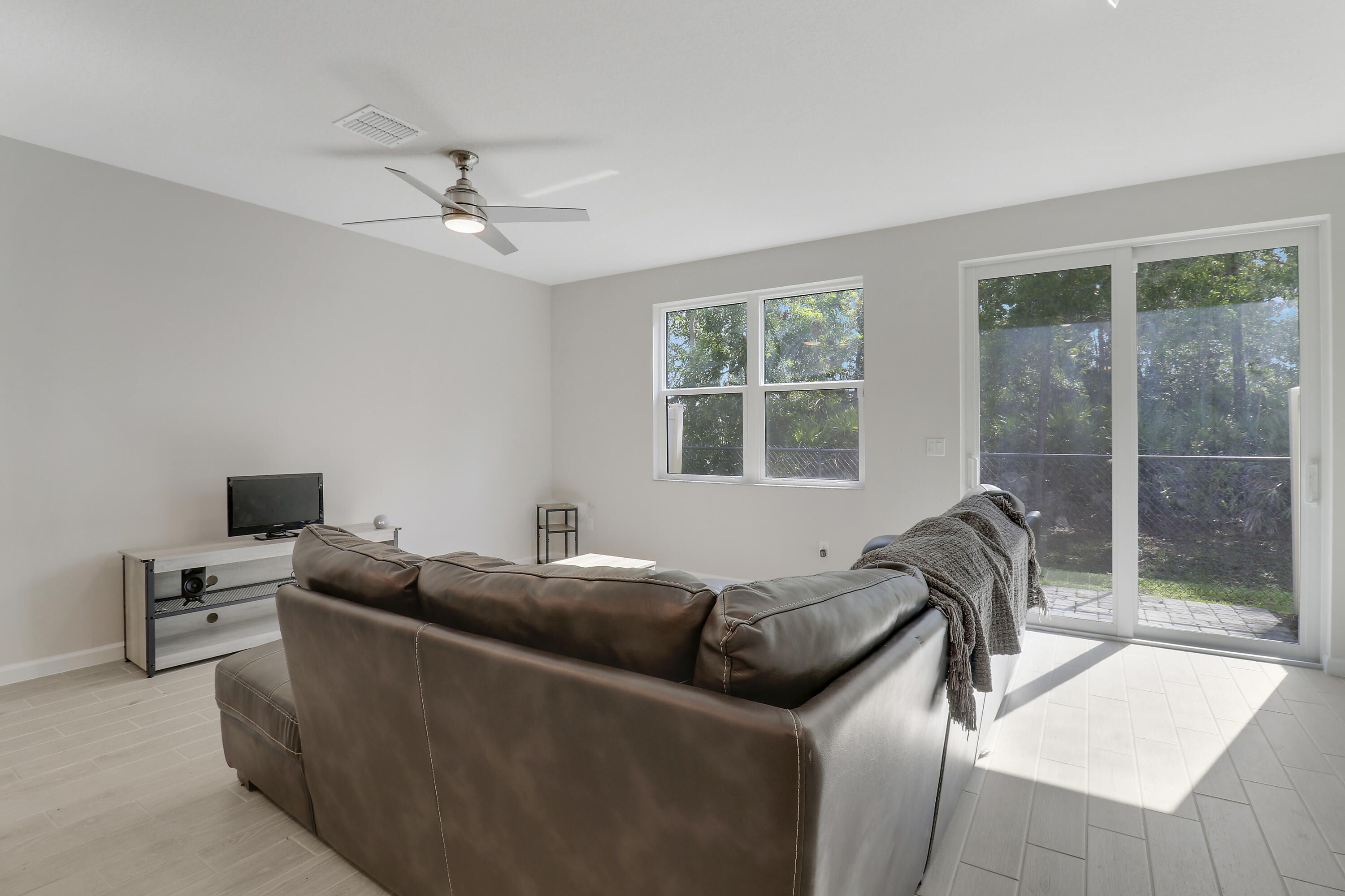 3903 Southeast Mentmore Lane Stuart, FL 34997 - Photo 21 of 35 a bedroom with a bed and a window