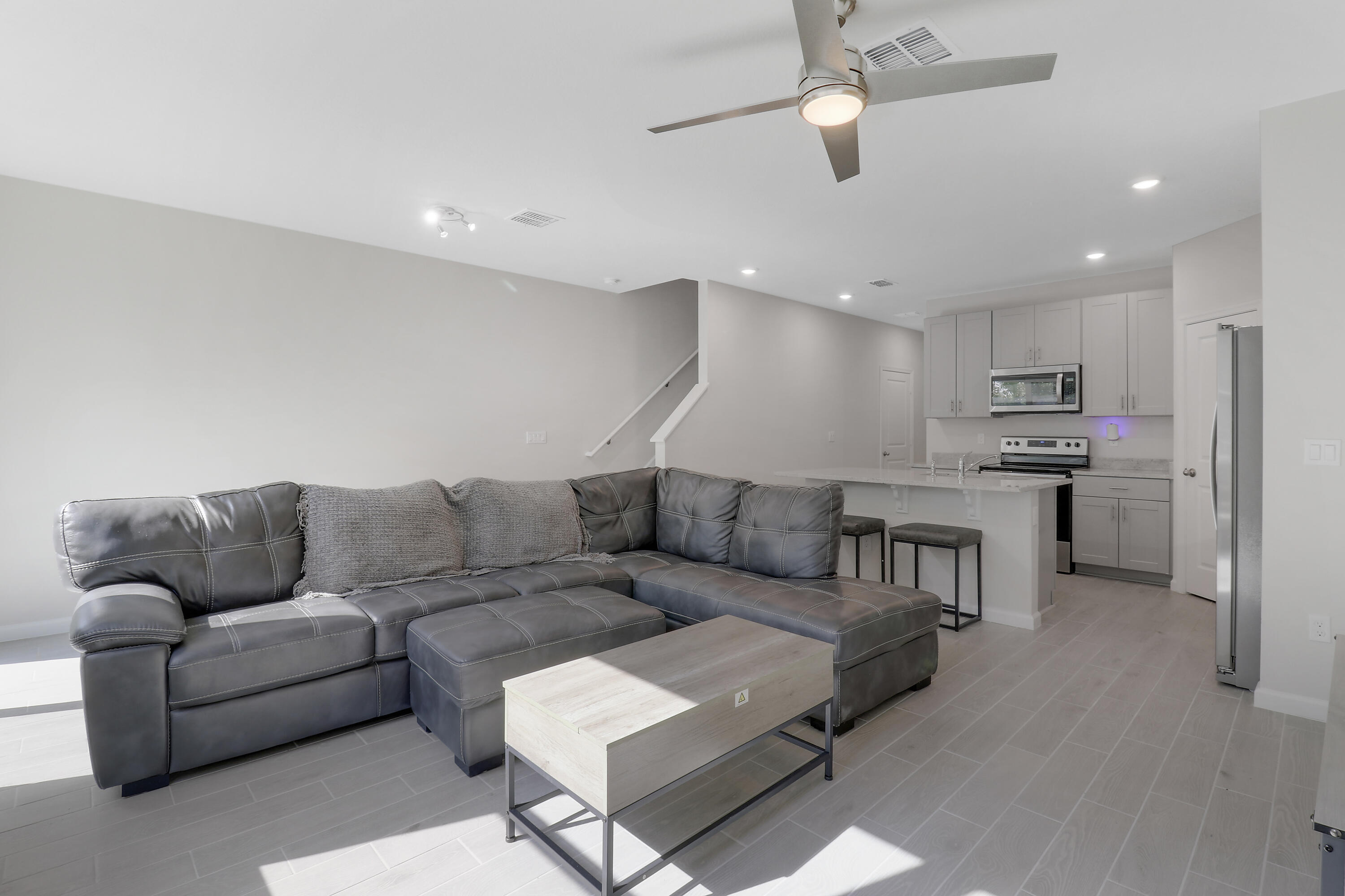 3903 Southeast Mentmore Lane Stuart, FL 34997 - Photo 25 of 35 a living room with furniture and kitchen view