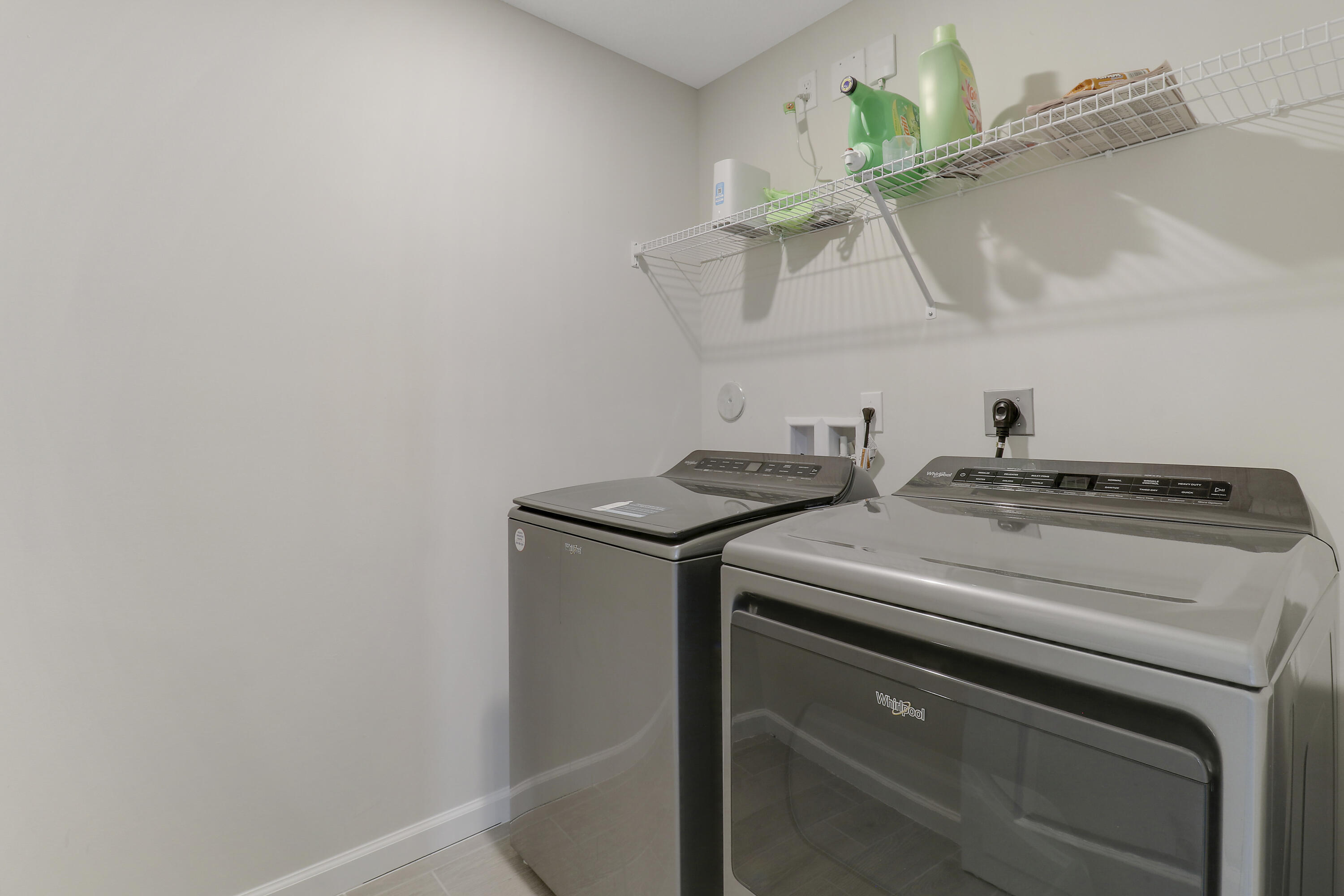 3903 Southeast Mentmore Lane Stuart, FL 34997 - Photo 30 of 35 a utility room with dryer and washer