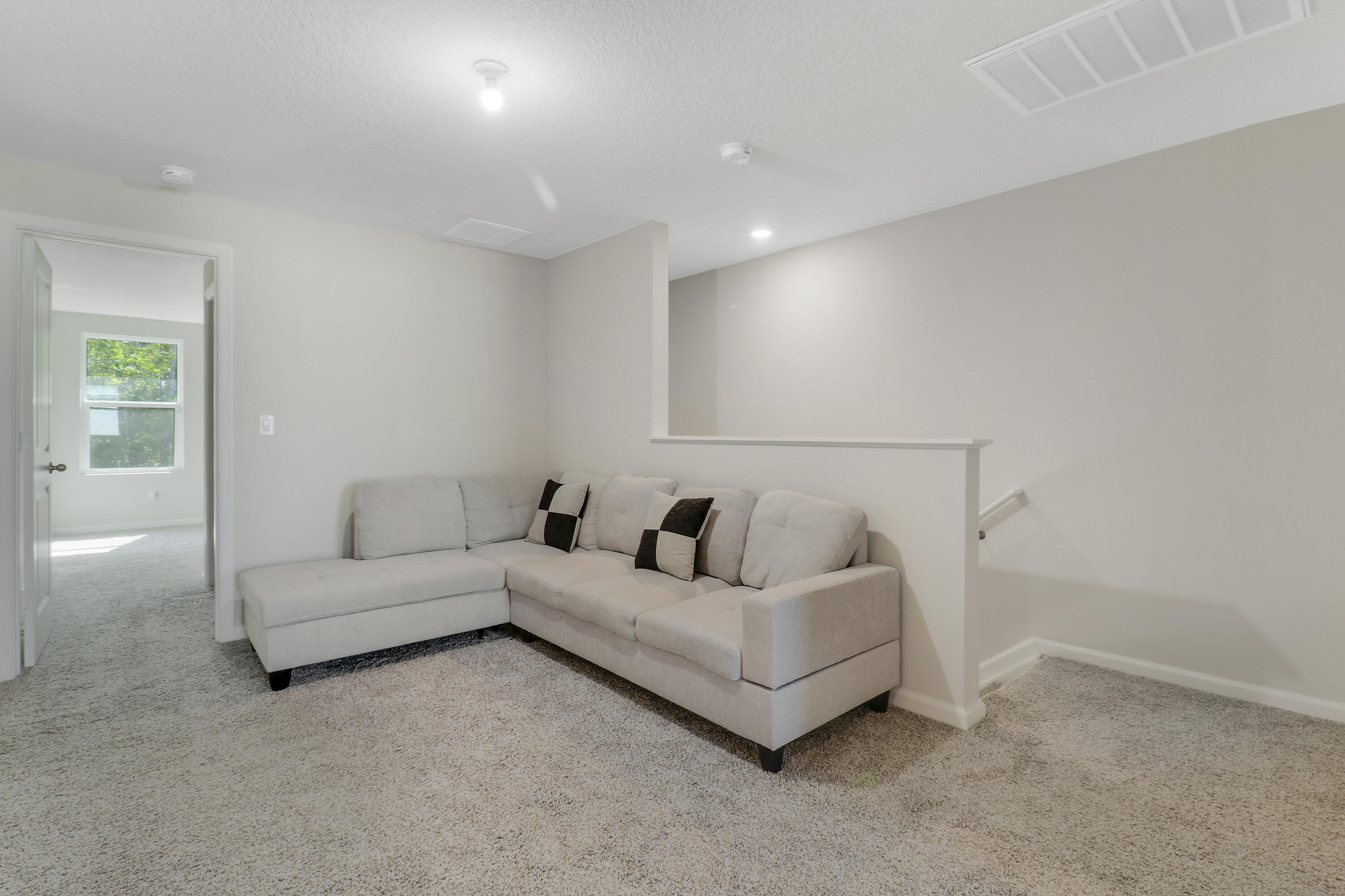 3903 Southeast Mentmore Lane Stuart, FL 34997 - Photo 32 of 35 a living room with furniture and a couch