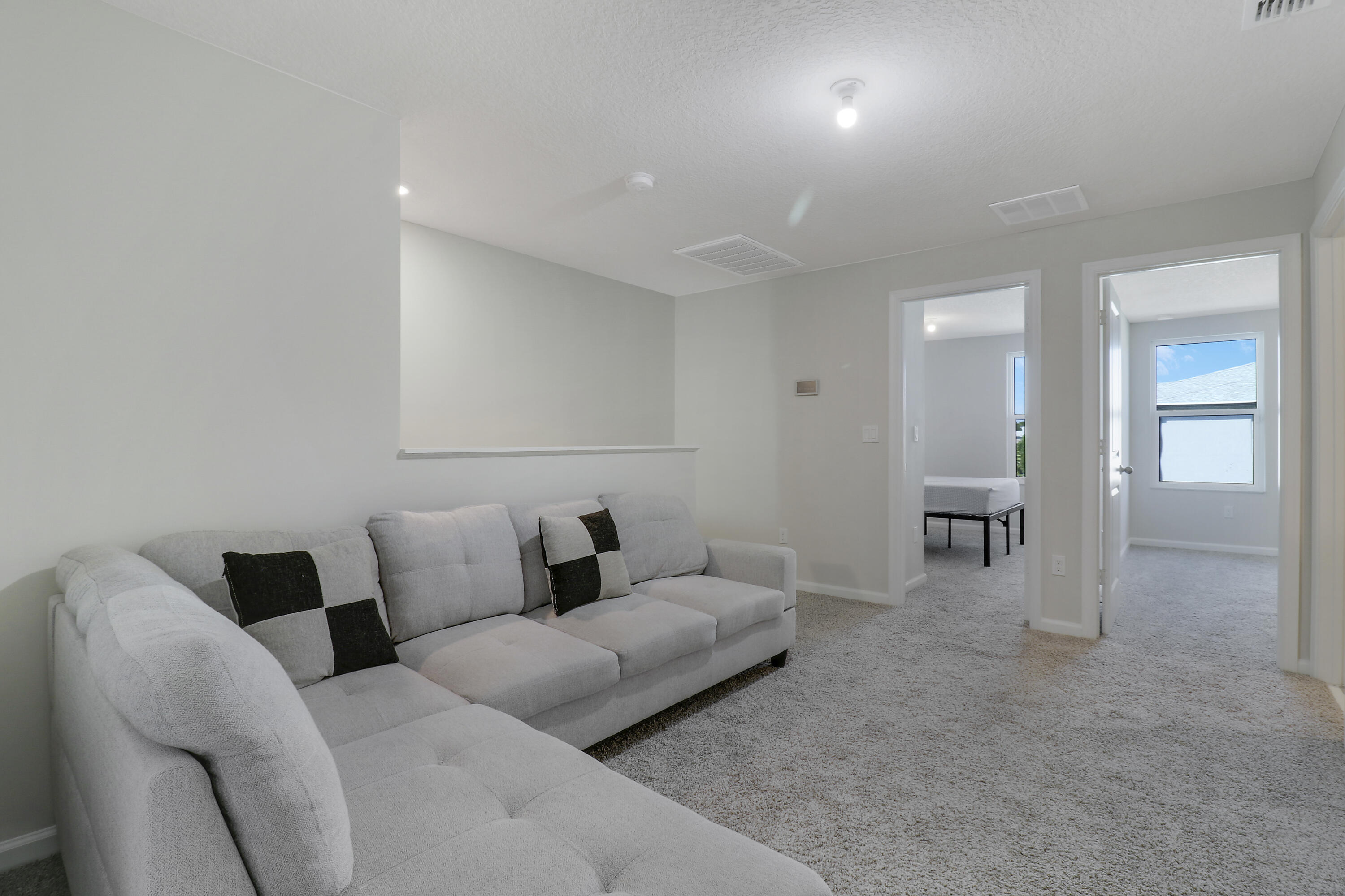 3903 Southeast Mentmore Lane Stuart, FL 34997 - Photo 33 of 35 a living room with furniture and window
