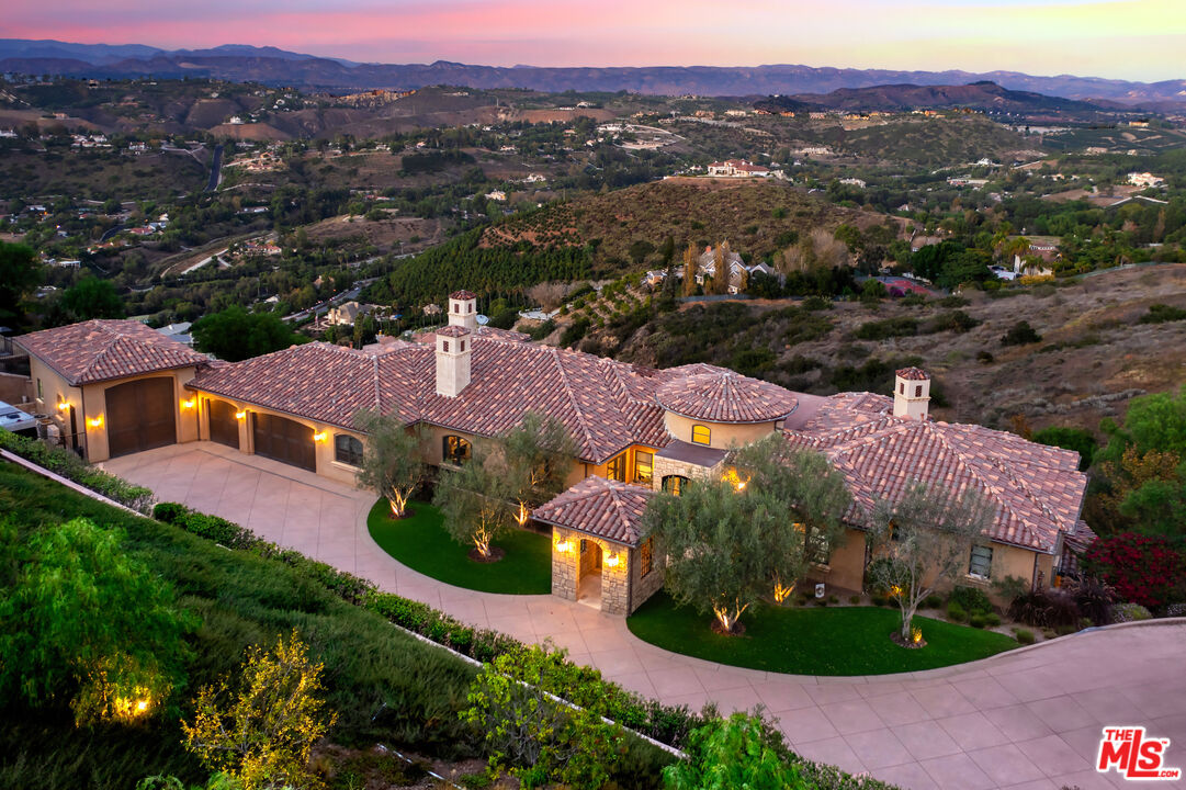 an aerial view of a house with garden