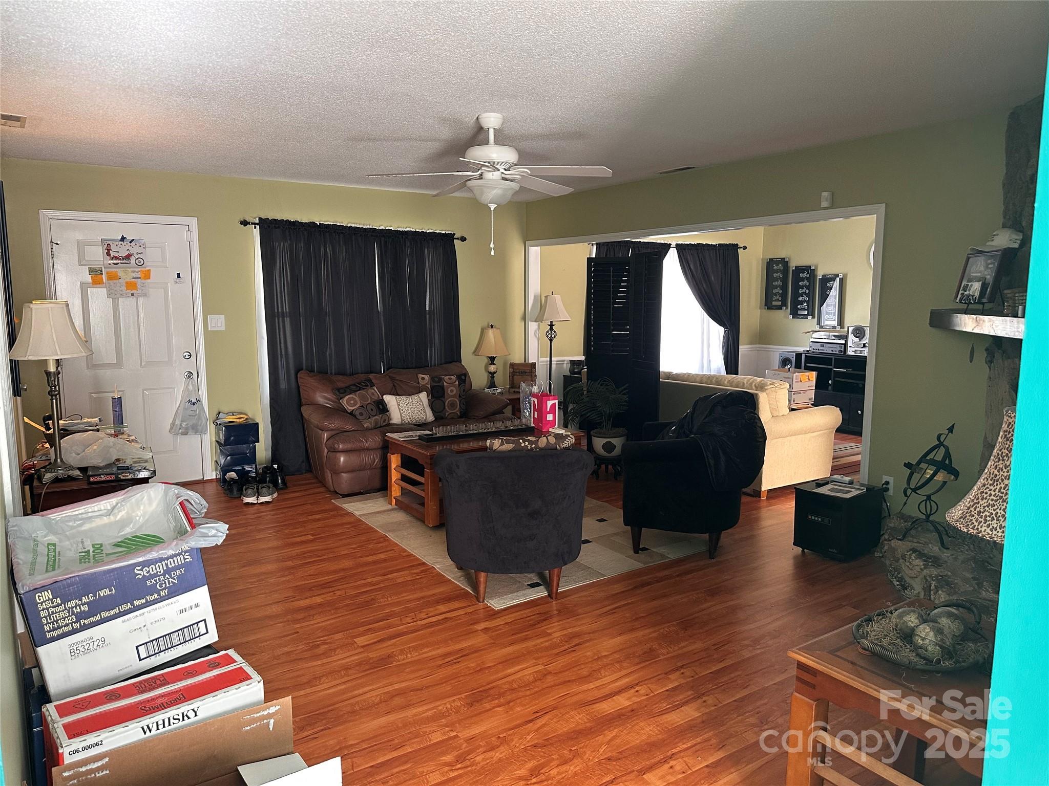 155 Park Villa Road Salisbury, NC 28146 - Photo 11 of 11 a living room with furniture and a chandelier