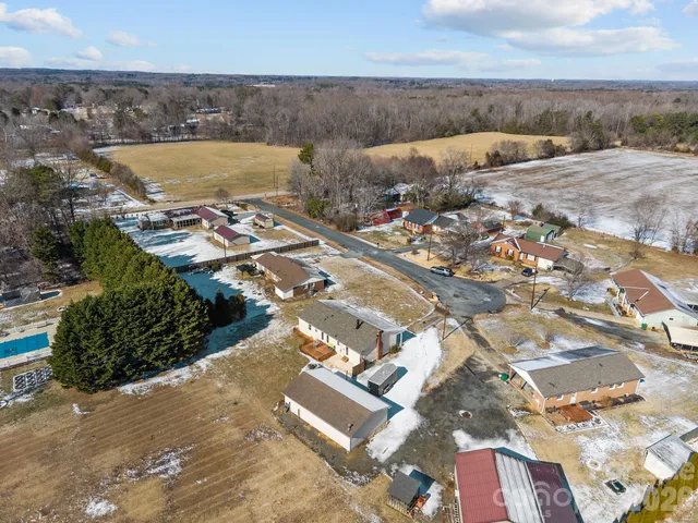 an aerial view of a house with a garden