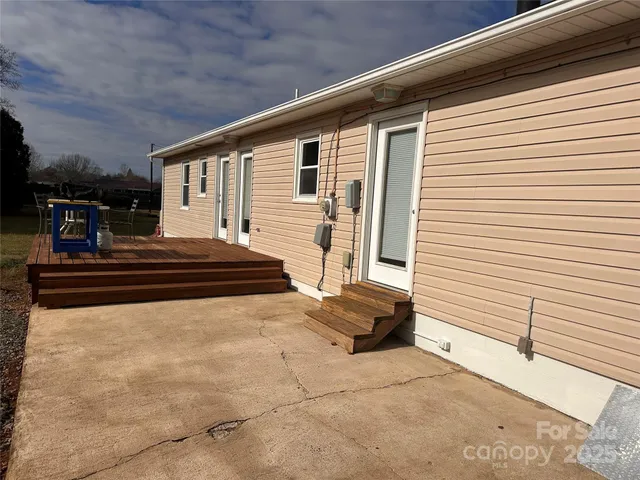 a view of backyard with sitting area