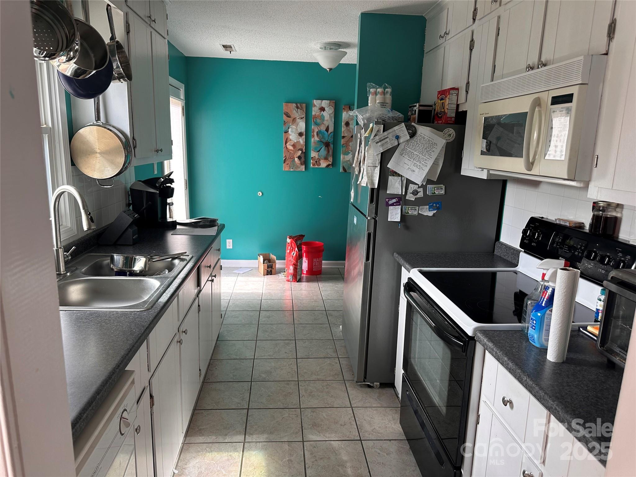 155 Park Villa Road Salisbury, NC 28146 - Photo 10 of 11 a kitchen with granite countertop a sink stove and cabinets