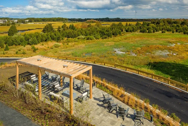 a view of a ocean with a mountain in the background