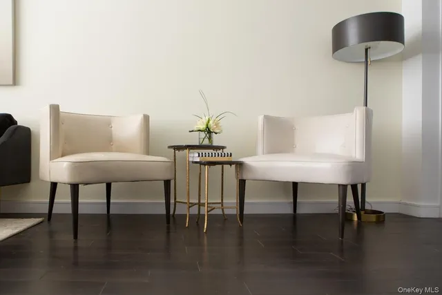 a living room with furniture and a lamp