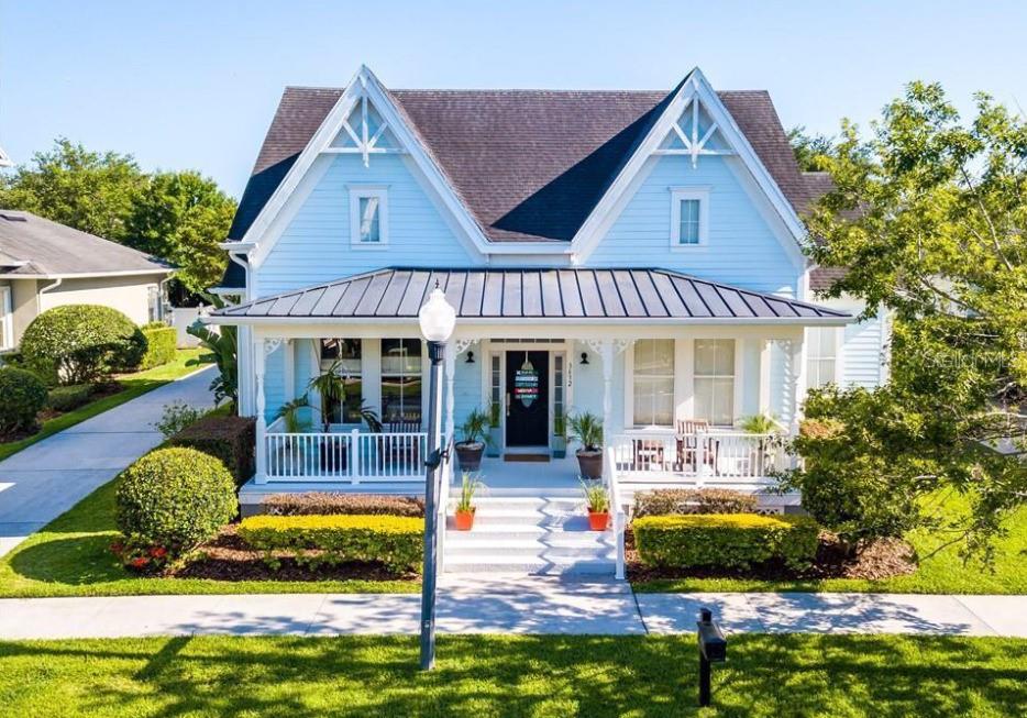 a view of house with swimming pool outdoor seating and yard