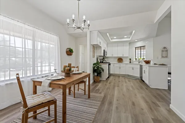 a view of a dining room with furniture window and wooden floor