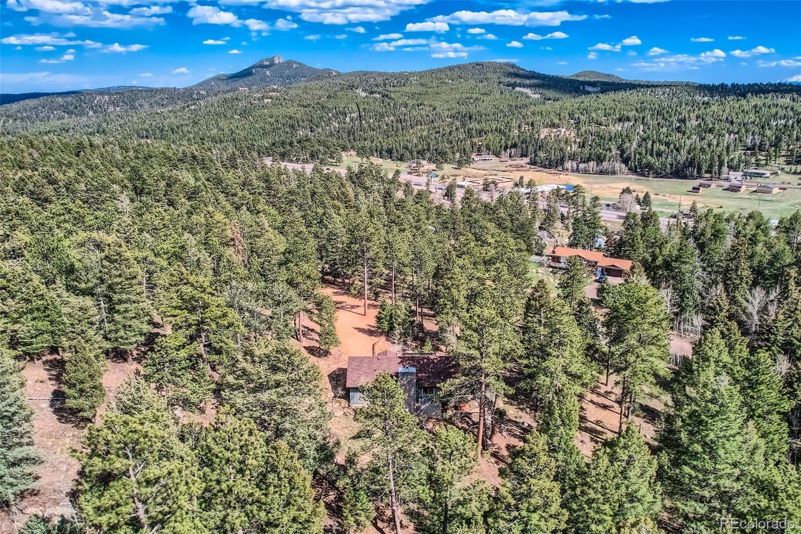 28669 Mountain View Road Conifer, CO 80433 - Photo 38 of 40 a view of a yard with an outdoor space