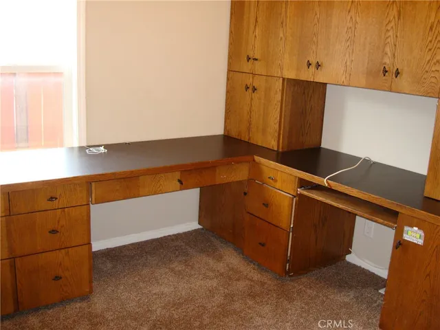 a stove top oven sitting inside of a kitchen