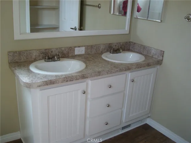 a bathroom with a glass shower door