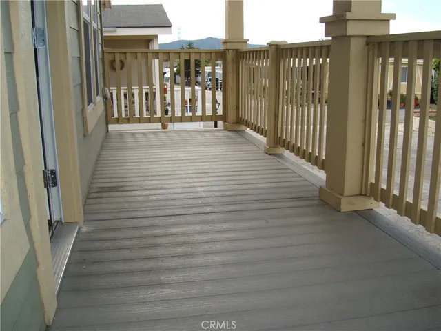a view of a house with wooden fence
