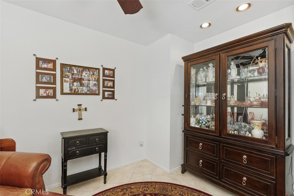 25644 Pelion Road Menifee, CA 92584 - Photo 12 of 26 a bedroom with a bed and wooden floor