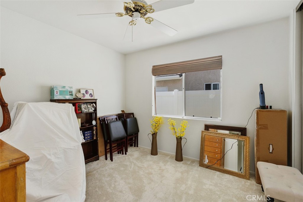 25644 Pelion Road Menifee, CA 92584 - Photo 14 of 26 a living room with furniture and a chandelier