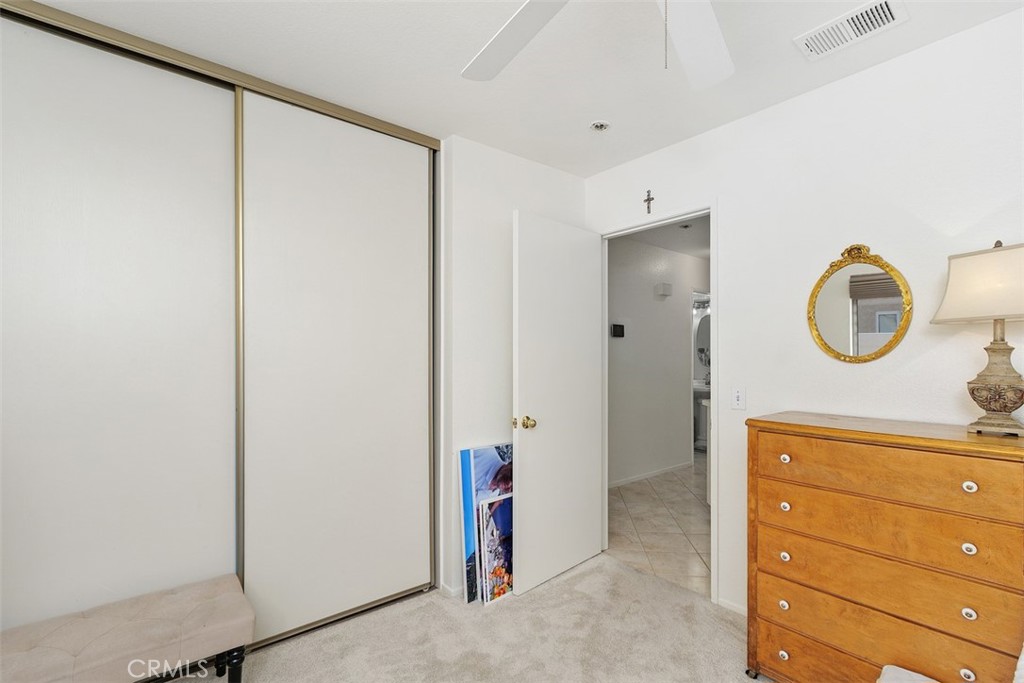 25644 Pelion Road Menifee, CA 92584 - Photo 15 of 26 a view of a hallway with closet
