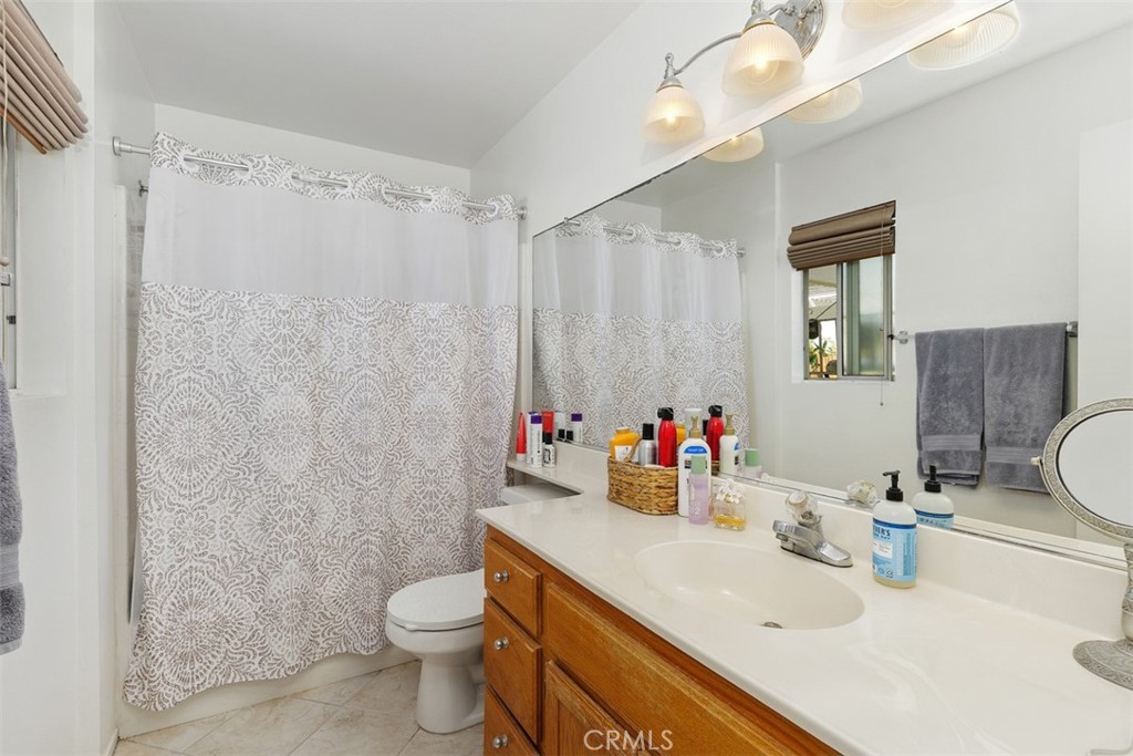 25644 Pelion Road Menifee, CA 92584 - Photo 20 of 26 a bathroom with a sink toilet tub and shower