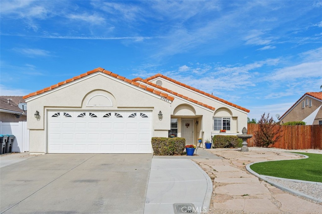 25644 Pelion Road Menifee, CA 92584 - Photo 2 of 26 a front view of a house with a yard