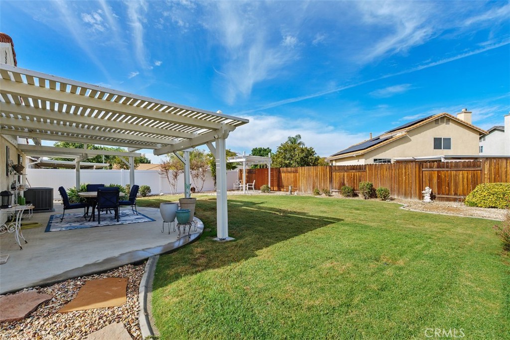 25644 Pelion Road Menifee, CA 92584 - Photo 22 of 26 a view of a house with backyard porch and sitting area