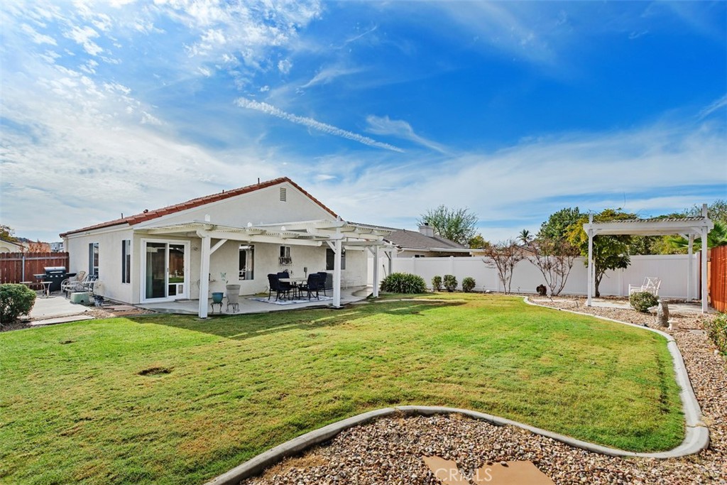 25644 Pelion Road Menifee, CA 92584 - Photo 26 of 26 a view of a house with a big yard and large tree