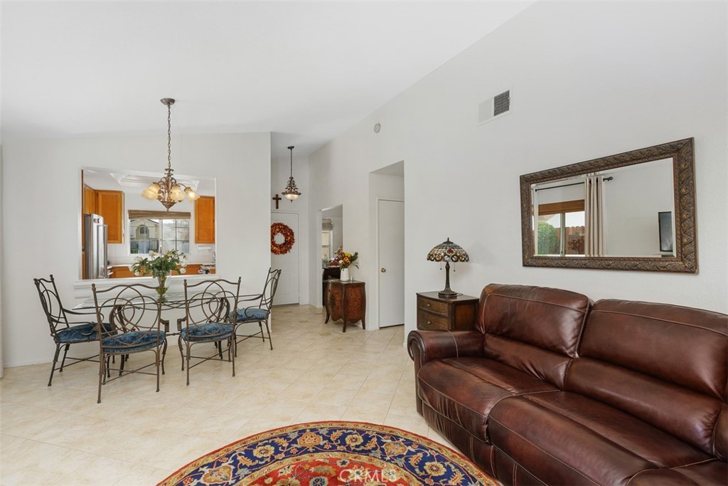 25644 Pelion Road Menifee, CA 92584 - Photo 7 of 26 a living room with furniture a window and a table