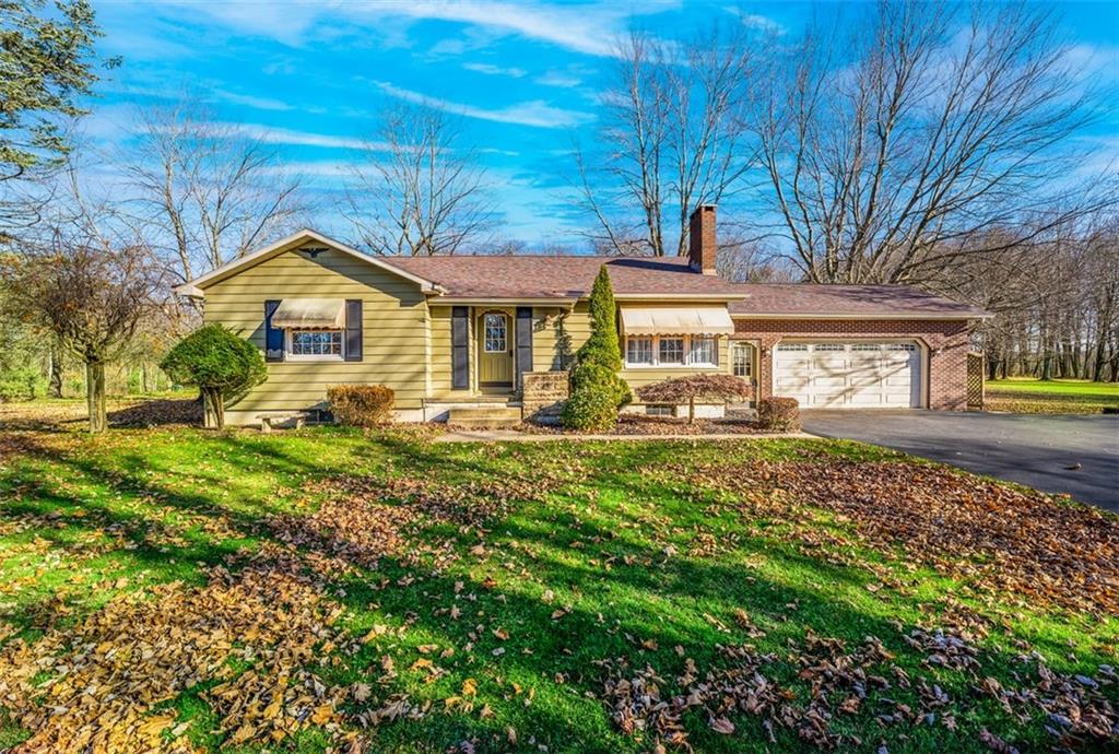 3128 New Butler Road New Castle, PA 16101 - Photo 1 of 12 a front view of a house with garden