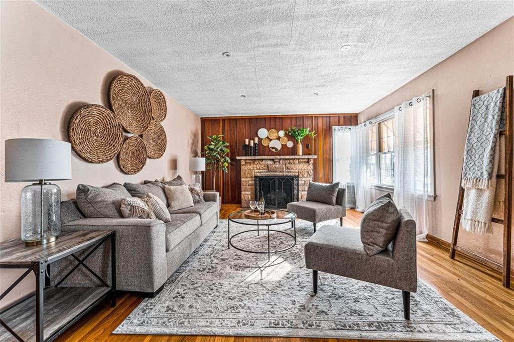 3128 New Butler Road New Castle, PA 16101 - Photo 2 of 12 a living room with furniture a fireplace and a large window