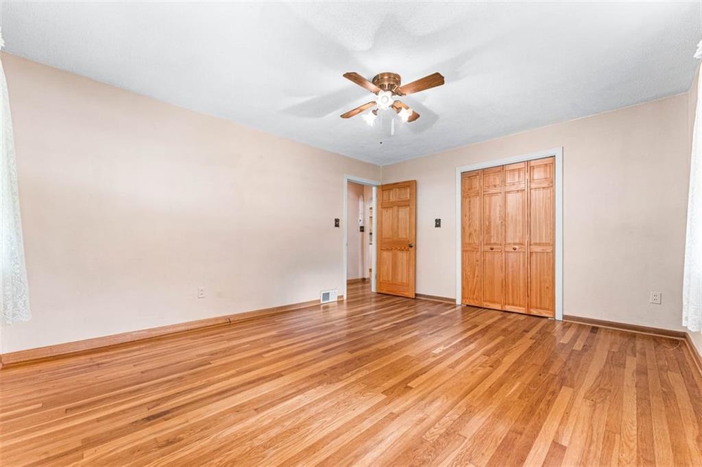 3128 New Butler Road New Castle, PA 16101 - Photo 8 of 12 an empty room with wooden floor and windows