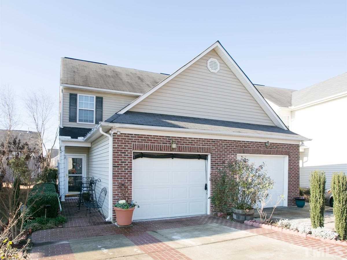 2025 Persimmon Ridge Drive Raleigh, NC 27604 - Photo 1 of 19 a front view of a house with a garage