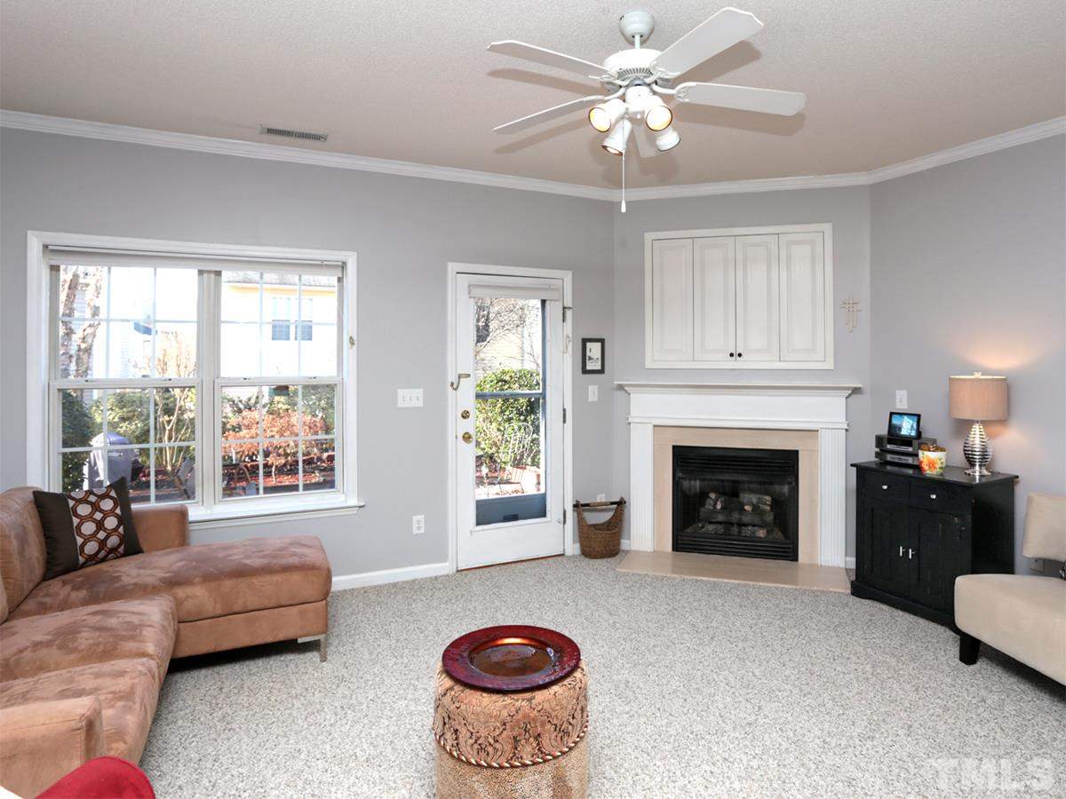 2025 Persimmon Ridge Drive Raleigh, NC 27604 - Photo 2 of 19 a living room with furniture and a fireplace