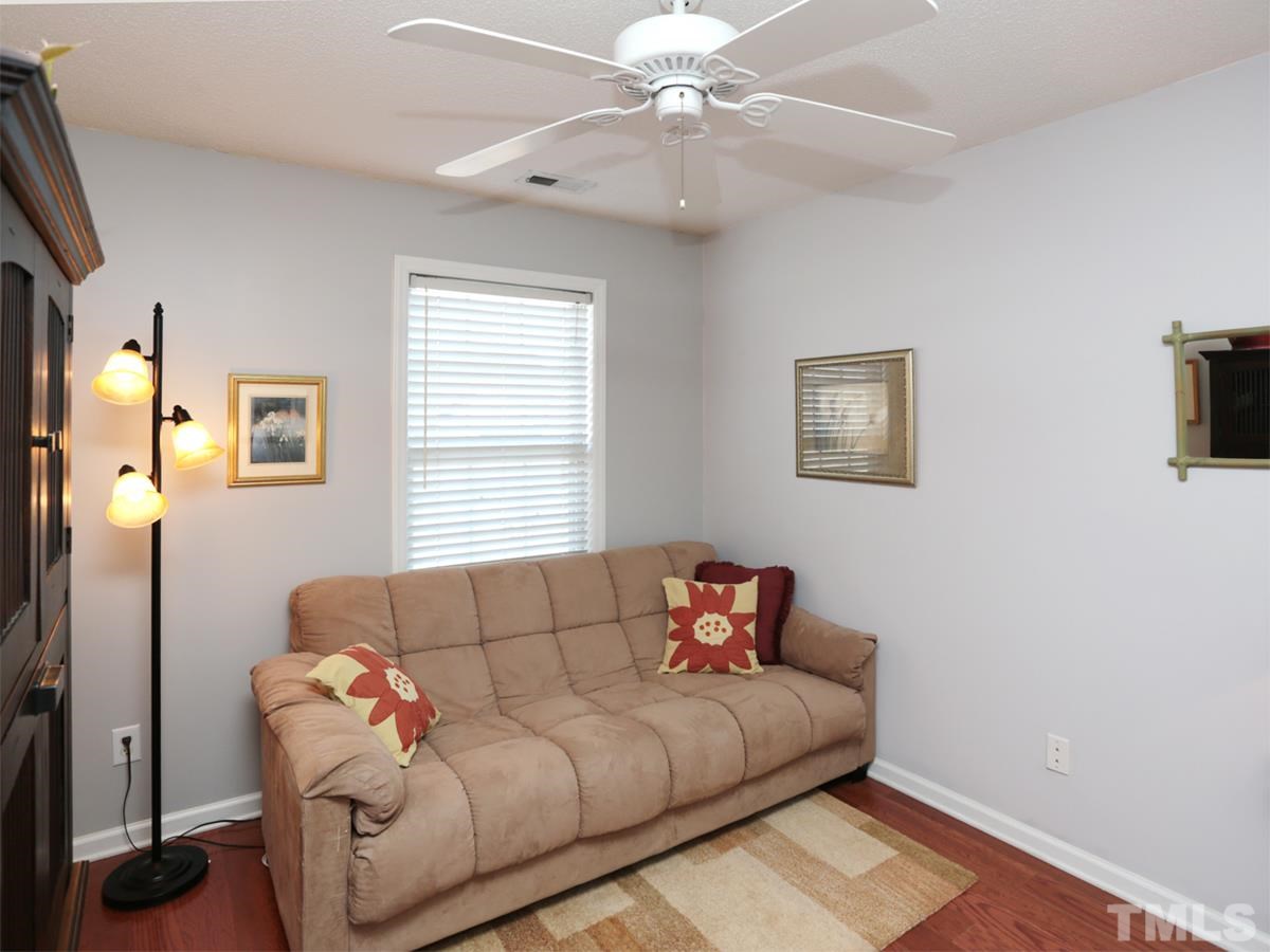 2025 Persimmon Ridge Drive Raleigh, NC 27604 - Photo 11 of 19 a living room with furniture and a window