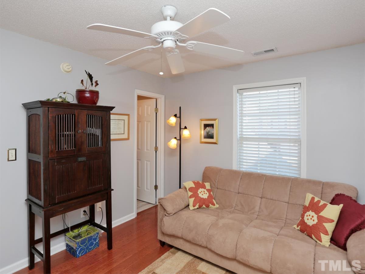 2025 Persimmon Ridge Drive Raleigh, NC 27604 - Photo 12 of 19 a living room with furniture and a window