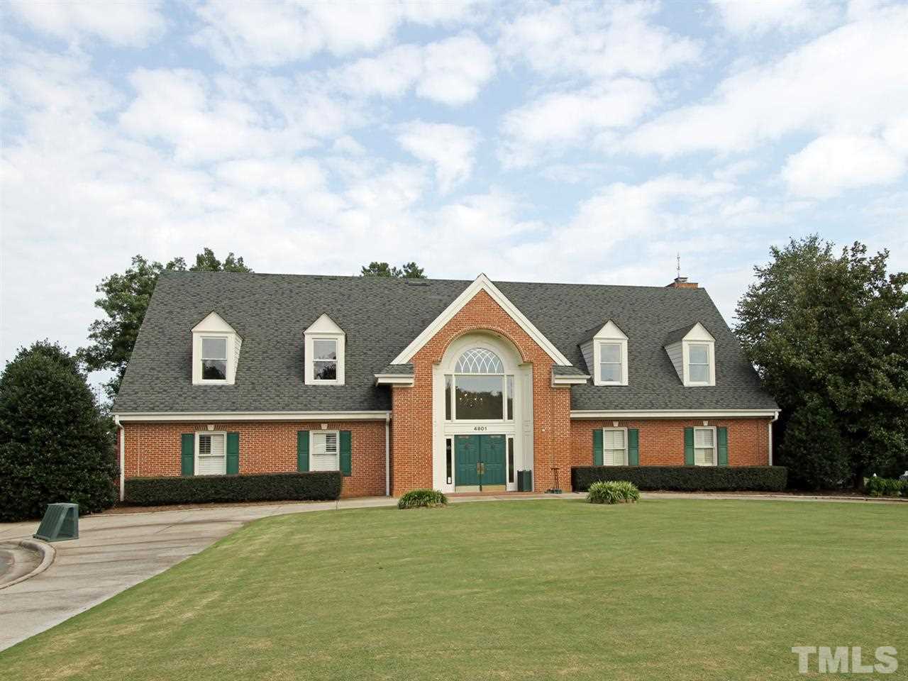 2025 Persimmon Ridge Drive Raleigh, NC 27604 - Photo 16 of 19 a front view of a house with a garden