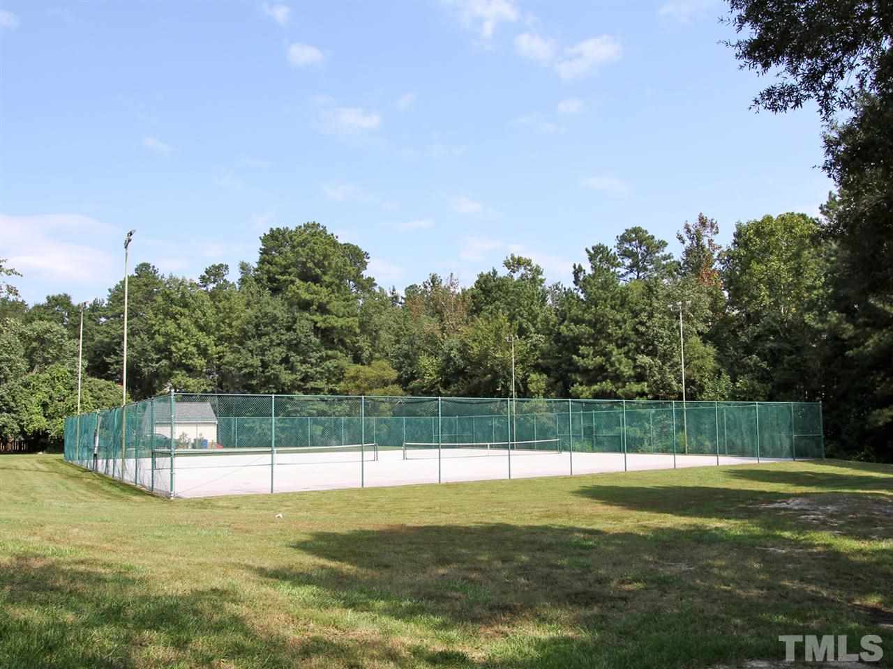 2025 Persimmon Ridge Drive Raleigh, NC 27604 - Photo 19 of 19 a view of a swimming pool with a yard