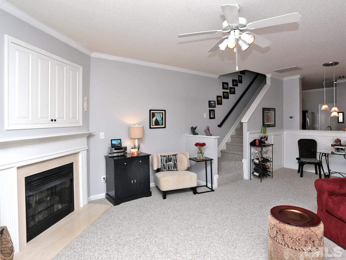 2025 Persimmon Ridge Drive Raleigh, NC 27604 - Photo 4 of 19 a living room with furniture and a fireplace