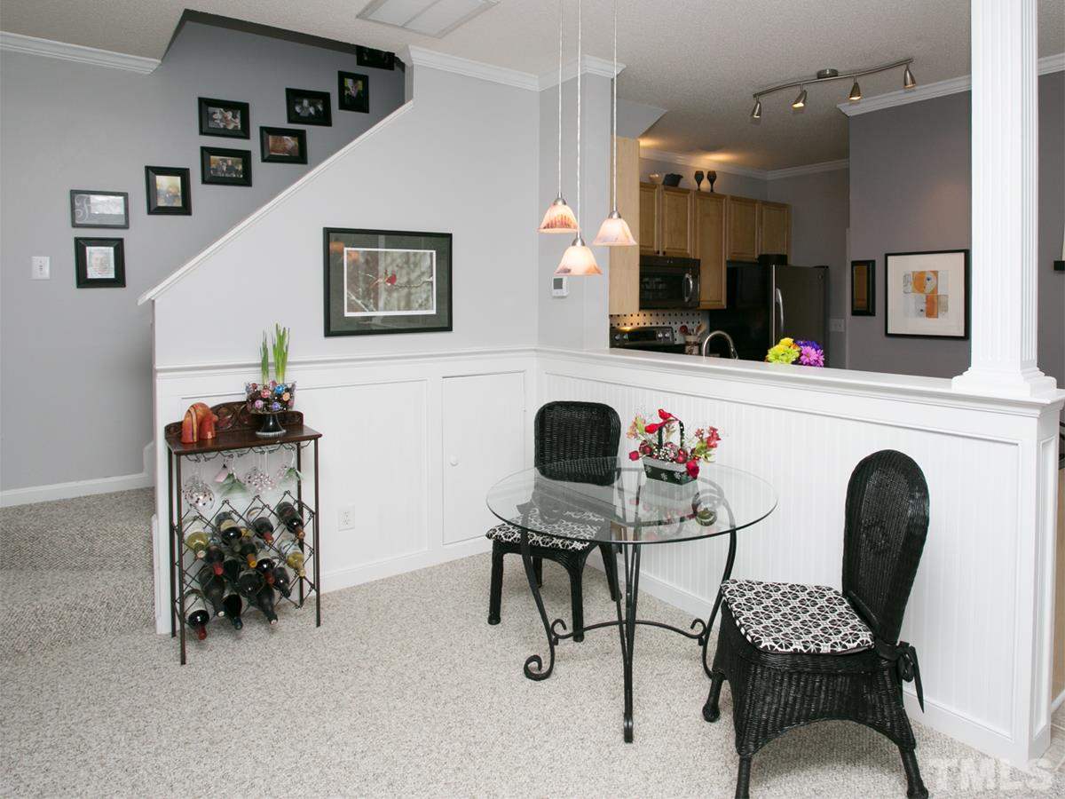 2025 Persimmon Ridge Drive Raleigh, NC 27604 - Photo 7 of 19 a living room with furniture and a potted plant