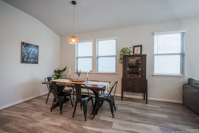 a dining room with furniture and window