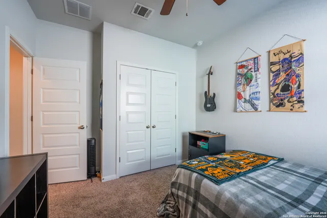 a bedroom with a bed and dresser